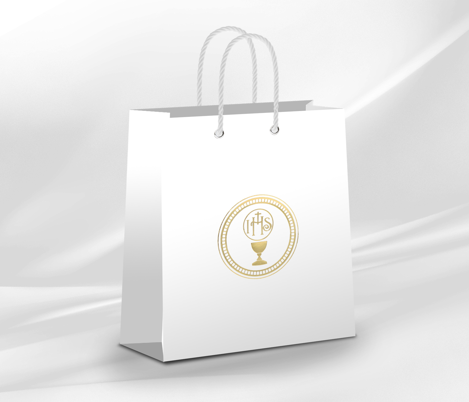 Elegancka torebka prezentowa na I Komunię Świętą z symbolem IHS i złotym zdobieniem