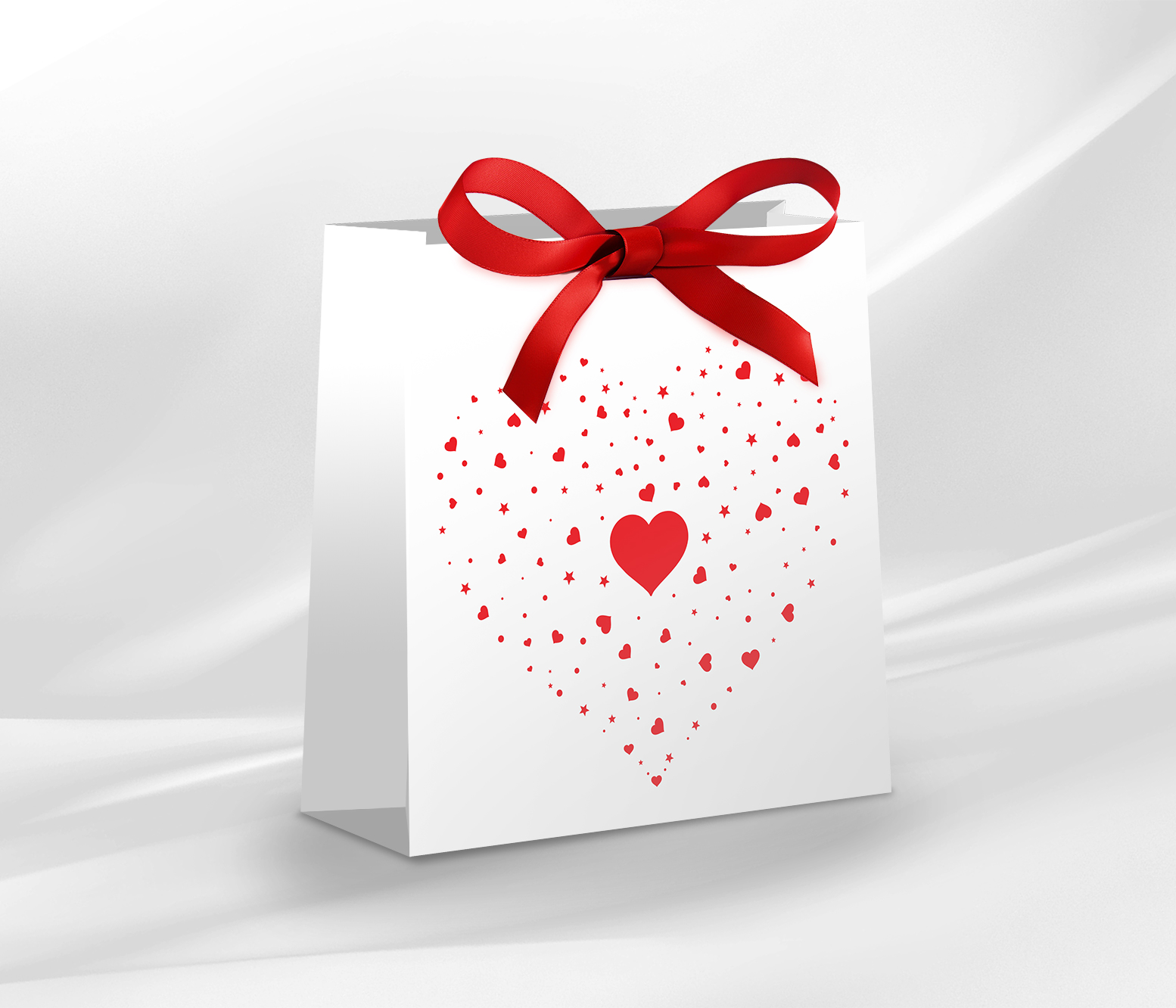 Piękna torebka jubilerska z motywem serca, ozdobiona czerwoną kokardką